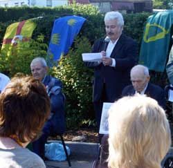 Manus O'Riordan, son of Spanish Civil War veteran Michael O'Riordan addresses the Kit Conway commemoration. His father is seated to the left and vet. Bob Doyle to the right