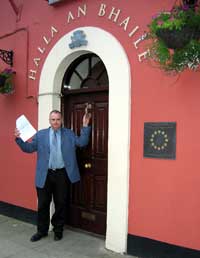 Cllr. Cionnaith Ó Súilleabháin stands locked outside Clonakilty Town Hall after the Mayoral Election, holding a copy of the agreement that was shredded by the very people who drew it up - Fianna Fáil and Fine Gael