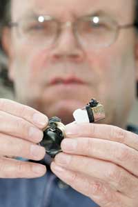 Cllr. Tom Hartley displays bomb fragments