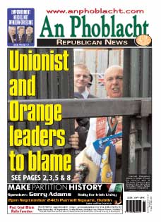 Frenzied Orangemen attempt to smash through the security gate at Workman Avenue to gain access to the nationalist Springfield Road in Belfast on Saturday 10 September