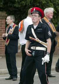 Orange marcher displays his 'culture' - note his fly!