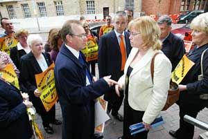 Sinn Féin education spokesperson Michael Ferguson confronts British Direct Rule Minister on Saturday 17 September at the Holiday Inn, Belfast where she addressed a NILGA conference