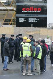 • A line of Gardai secure the entrance of the Collen building site in UCD, as supporter of the Ballybrack Three Andrew Clare, Billy McClurg and Keith Kelly protest outside the site, 22 February 2006