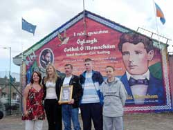 Laura McAree, Mayor of Kerry Toireasa Ní Fhearaoisa, Liam McAree, Terry and Frank McKenna at the newly painted mural in memory of Charlie Monahan on Mountpottinger Road