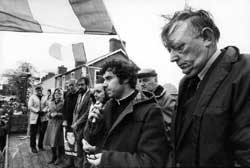 Fr Brian McCreesh (brother of hunger striker Raymond)  addressing an anti-H Block/Armagh rally. Sinn Féin Councillor John Davey (assassinated by loyalists in 1989) on the extreme right of picture