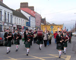 The parade was led by a colour party and Piobaira Uladh Pipe Band