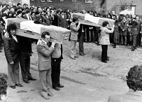 IRA Volunteers in full uniform fired a volley over the coffins of their comrades Volunteers Willie Fleming and Danny Doherty