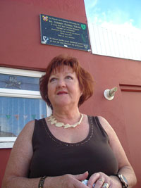 Maureen McGuinness, wife of Tommy ‘Todler’ Tolan stands in front of the memorial plaque to her husband