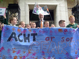 Francie Brolly with kids from Gaelscoil na Mona protesting at the BBC in Belfast, over the state run broadcaster’s lack of coverage of Irish language issues