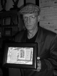 Paul Pierce with Williams’s prayer book that he wrote a message on the morning he was executed