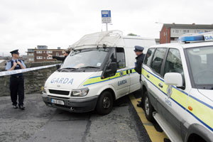 Gardai near the scene where a motorcycle traffic Garda was shot on Ossory Road in Dublin