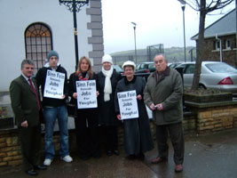 Sinn Féin TD Arthur Morgan and Councillor Martin Hallinan join local Sinn Féin member demanding job creation in Youghal during the Dáil fact-finding mission