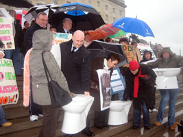 Alex Maskey with residents of the Village at the Stormont protest