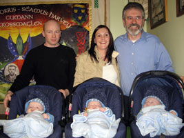 Gerry Adams photographed with proud parents of triplets