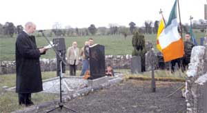 Caoimhghín Ó Caoláin speaking at the graveside of Larry Ginnell in Delvin