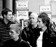 Local Sinn Féin activists join the picket in support of workers at the Ballymun Plaza Hotel