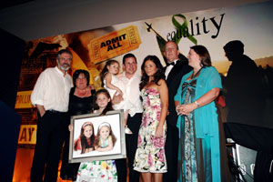 PRESENTATION: Gerry Adams with his wife Collette, granddaughter Drithle, son Gearóid holding another granddaughter Luisne, Gearóid’s wife Róisín, Bobby Storey and Michelle Gildernew