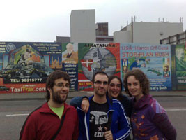 DELEGATION: Posing for a picture opposite the international mural wall in Belfast