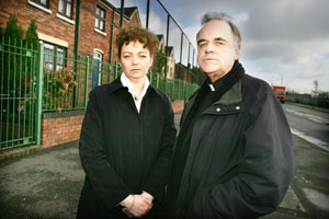 Sinn Féin MLA Carál Ní Chuilín and local priest Fr Aidan Troy at the North Queen Street interface recently