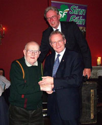 Josh Kielty gives Martin McGuinness a warm welcome as Maurice Roche looks on