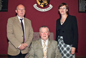 The new cathaoirleach of Cavan County Council, Charlie Boylan, flanked by party colleagues Paddy McDonald and Pauline McCauley following his election