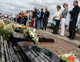 REMEMBRANCE: Ex-POWs and young republicans from Ógra Shinn Féin join members of the Doherty and McDonnell families in the wreath-laying ceremony at Milltown Cemetery