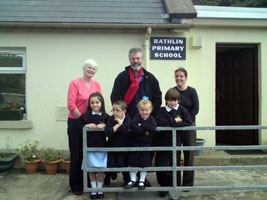 Gerry Adams with teachers and pupils at Rathlin Primary school