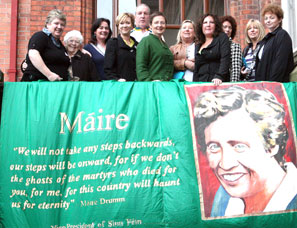 WOMEN OF THE WORLD: Conference delegates stand behind a banner honouring Sinn Féin Vice-President Máire Drumm, assassinated by a unionist death squad in her Mater Hospital bed in 1976