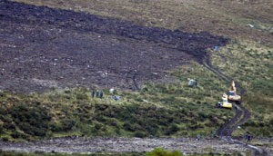 SEARCH: Diggers and workers search for what appears to be Danny McIlhone’s remains at Ballynultagh, in the Wicklow Mountains