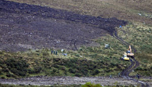 SEARCH: Diggers and workers search for what appears to be Danny McIlhone’s remains at Ballynultagh, in the Wicklow Mountains