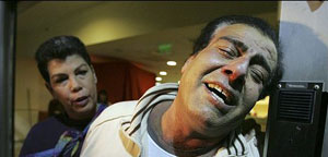 A grief stricken Dr Izeldeen Abuelaish, three of whose daughters and his niece were killed by Israeli shelling