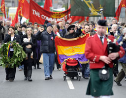 COMRADES COME RALLY: Bob Doyle’s ashes and the flag of the International Brigades lead a parade of several hundred down O’Connell Street