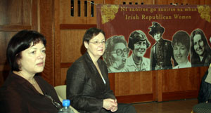 A WOMAN’S HEART: Margaret Ward and Bairbre de Brún alongside a banner remembering Máire Drumm, Sighle Humphries, Constance Markievicz and Sheena Campbell