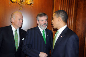 In conversation: US President Barack Obama and Vice President Joe Biden with Sinn Féin President Gerry Adams who presented Obama with a booklet especially made by children and young people in west Belfast