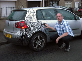 UNDETERRED: Bobby Storey inspects the damage