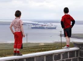 VIGILANT: Children watch Shell's pipelaying ship the Solitaire