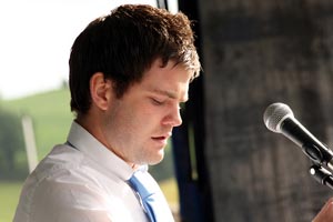 Liam Nugent reading the poem at the commemoration