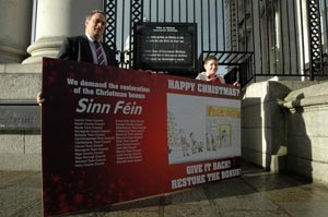 Aengus Ó Snodaigh and 12-year-old card designer Curtis Tysom outside Government Buildings
