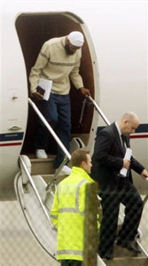 Binyam Mohamed, who was held at Guantanamo Bay, steps from a plane at Northolt military base in west London