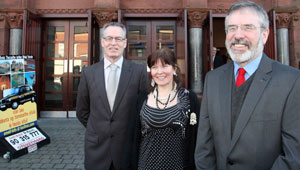 Gerry Adams and Gerry Kelly with Director of An Chultúrlann Eimear Ní Mhathúna outside the Falls Road building