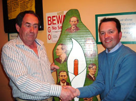 Martin Kelly, Sinn Féin representative for North Kildare, presenting raffle winner Danny Quigley from Monaghan with an original piece of art by Wolfe Tone Cumann member Billy McAndrew